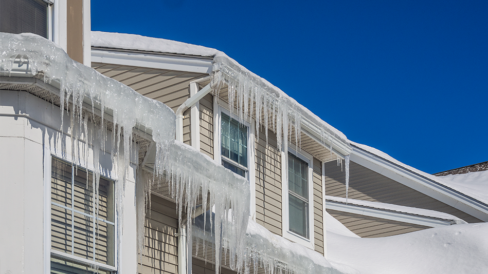 Long icicles line the edges of a multi-tiered roof