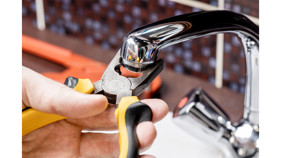 Pliers are used to remove the aerator from a faucet