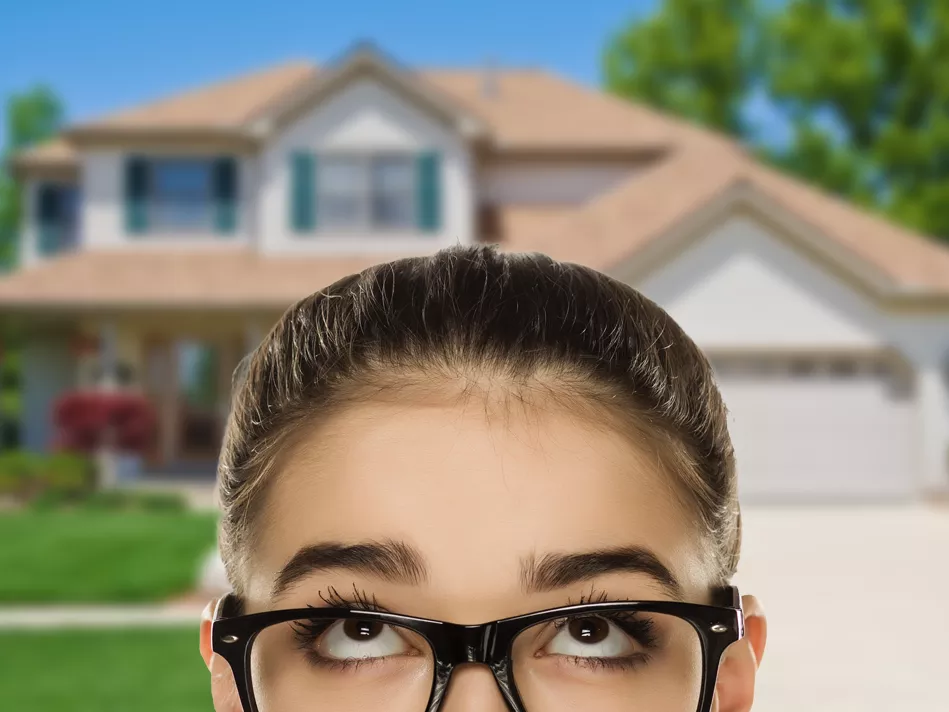 A woman in glasses considers: is a home warranty is worth it?