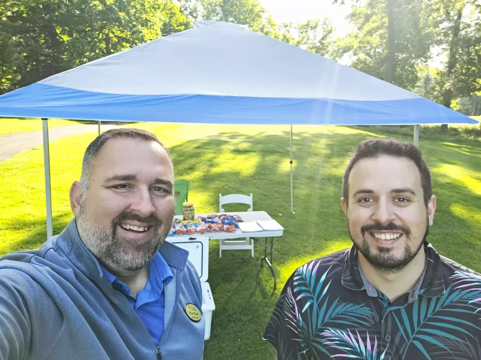 Brian Heath and Tyler James smile for a pic at the 5th hole at the charity golf outing